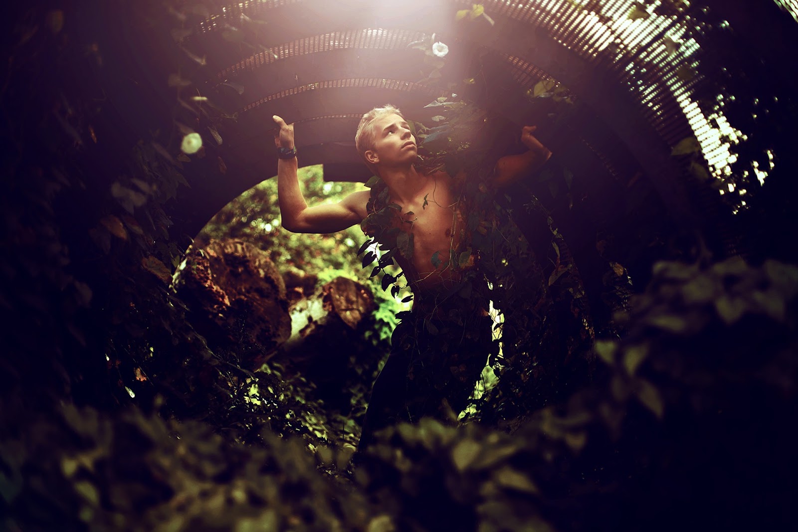 Man covered in vine plants