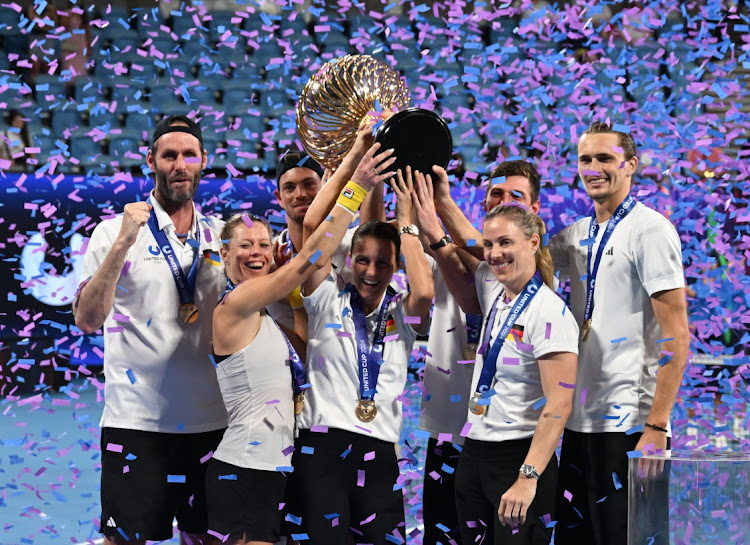 Team captain Torben Beltz and his players Alexander Zverev, Angelique Kerber, Maximilian Marterer, Kai Wehnelt, Tatjana Maria and Laura Siegemund celebrate with the trophy after Germany win the United Cup at Ken Rosewall Arena in Sydney, Australia, January 7 2024. Picture: JAIMI JOY/REUTERS