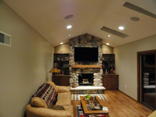 living room with fireplace and tv on opposite walls