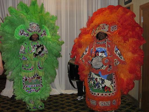 Two Mardi Gras Indians danced