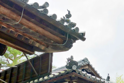 The Guardian Lions at the entrance gate roofs of Kinkakuji (Golden Pavilion) in Kyoto