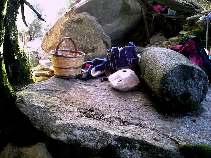 Our baskets, bags and gear on the old stone where the people of the 'lost village' used to crush olives for their oil