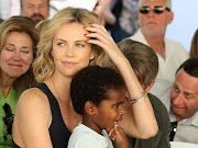 Charlize Theron with a much younger Jackson Theron, who's since identified as a girl. File photo.