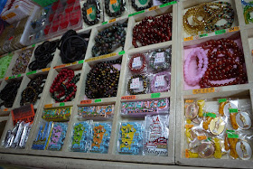 Penang magnets, bracelets, and other items for sale at a shop in Kek Lok Temple