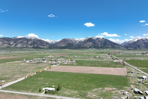 Buy this luxury apartment / penthouse in Thayne (United States) - Aerial view green fields snow-capped mountains