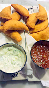 DaNet, a Russian Dinner Party which pops up at the Portland Penny Diner twice a month. Fried beef piroshky is passed as people are finding their assigned seats