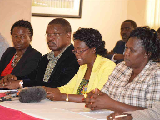 Kisii Health executive Sarah Omache (in yellow top) and her counterparts from LREB member counties address the press in Kisumu.