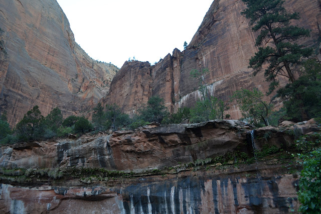 water falling from the huge lip of rock above