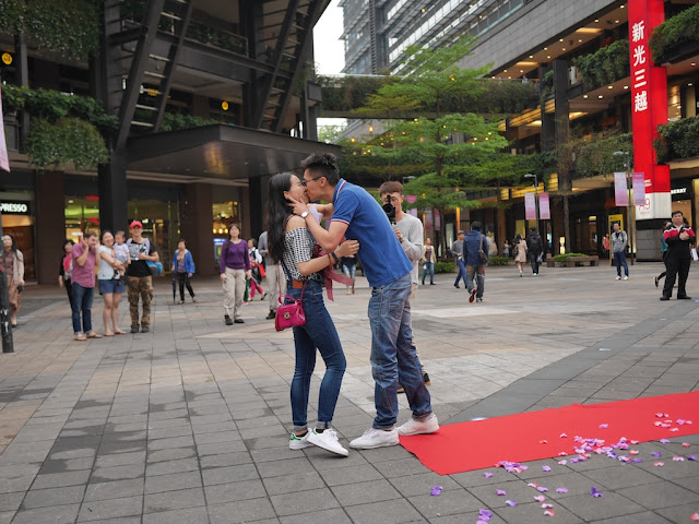 newly engaged couple kissing