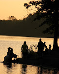 Gathering by the lake at sunset.