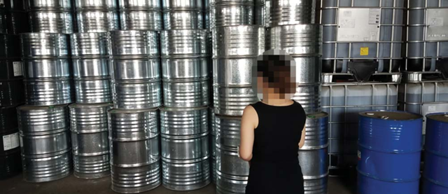 Staff at Dacheng Desheng Chemical Co., Ltd shows barrels containing illegal CFC-11. Photo: EIA