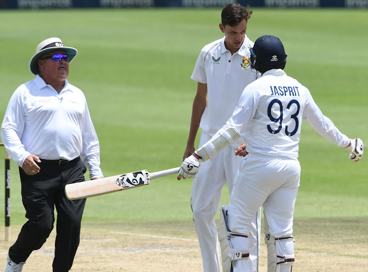 Umpire Marais Erasmus jogs in to have a chat with Jasprit Bumrah and Marco Jansen as they have an altercation on day three of the second Test at the Wanderers in Johannesburg on January 5 2022.