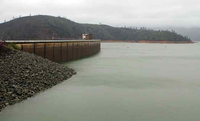 The shore of Lake Shasta behind Shasta Dam in Lake Shasta, California, is seen Sunday, 13 March 2016. The lake's water level has been rising after a series of storms brought strong winds, periods of heavy rain, snow and high surf to California Sunday, the fourth straight day of wet weather. The lake is rising after several years of dropping water levels due to the ongoing California drought. Photo: Nathan Solis / The Record Searchlight