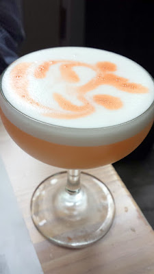 LeChon cocktail Mediterraneo with pisco, cardamom infusion, egg white, and lime