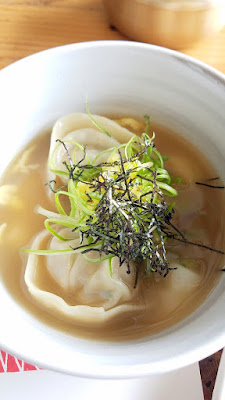 Han Oak, A bowl of pork and chive dumpling soup with beef broth, rice cake, egg and nori