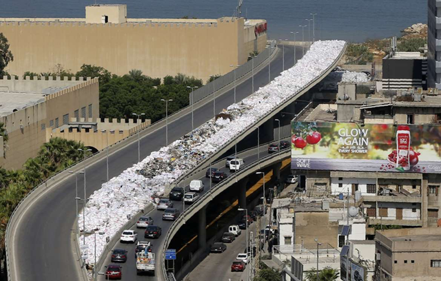 A river of white-bagged garbage winds through Beirut, Lebanon. Photo: Joseph Eid / AFP / Getty Images