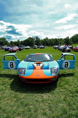 Gulf coloured Ford GT  6. At the time these people were preparing to leave,