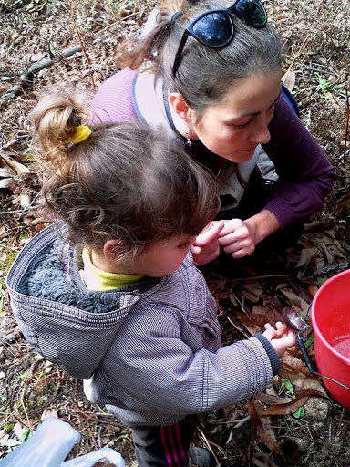 Mother and daughter examining the harvest