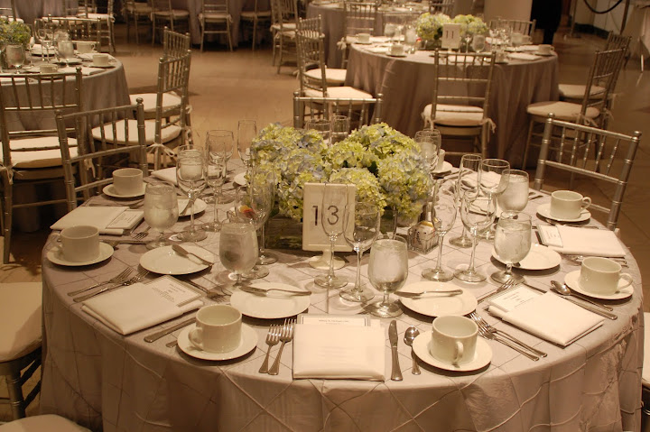 Hydrangea centerpiece on a silver pintuck linen