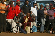 Community members cheer during a Pantsula dance competition on May 11, 2013 in Soweto, South Africa. Soweto hosted an informal dance-off competiton over the weekend to revive street dance.