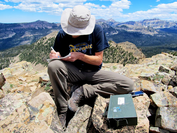 Chris signing the geocache log