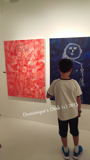 Monkey boy looking at a painting 