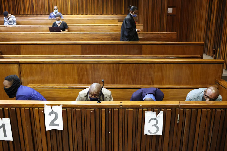 The four policemen, From left, Tshepiso Kekana, Cidraas Motseothatha, Madimetja Legodi and Victor Mohammed, accused of murdering Mthokozisi Ntumba who died after being caught in the crossfire during student protests last year, 25 January 2022, at the Johannesburg High court in the CBD.