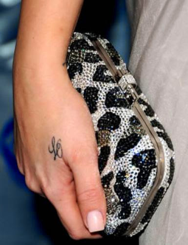 Khloe Kardashian Explains Why She Hasnt Removed Her Lamar Odom Hand Tattoo