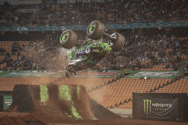 Monster Truck 'Grave Digger' performs a front flip.