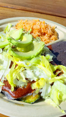 Portland Mercado has 8 carts in the food cart pod, where each food cart specializes in different Latin cuisine. Tierra del Sol specializes in Oaxacan Cuisine. Here is a veggie mole enchilada using handmade blue corn tortillas along with veggie stew and topped with mole, lettuce, red onion, queso fresco, sour cream from Ochoa Quesaria in Albany Oregon and served with a side of rice and beans