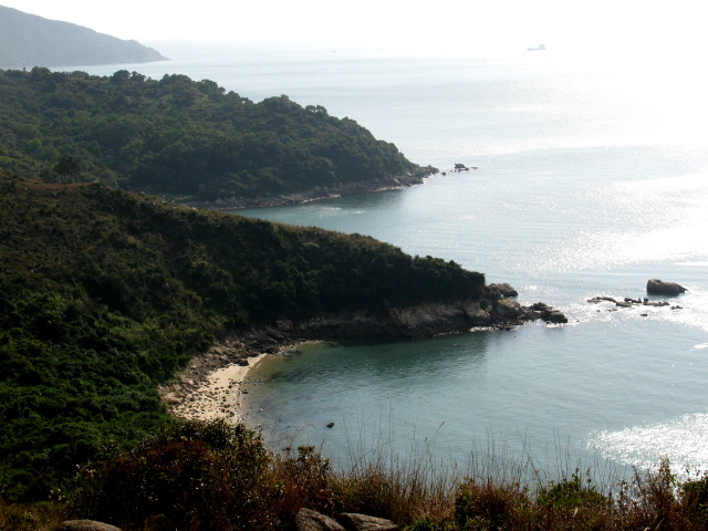 a little cove with a bit of beach