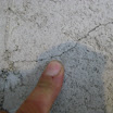 Even this hairline foundation crack can be repaired using our low pressure repair method.  A liquid polyurethane resin is injected into the concrete wall crack. The polyurethane foams and expands up to 30x and completely fills the crack and stops the leak.
