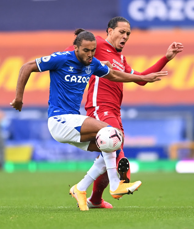 Liverpool's Virgil van Dijk in action with Everton's Dominic Calvert-Lewin