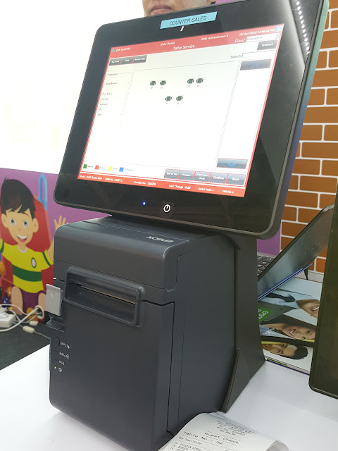 Tablet mounted on top of an Epson receipt printer.