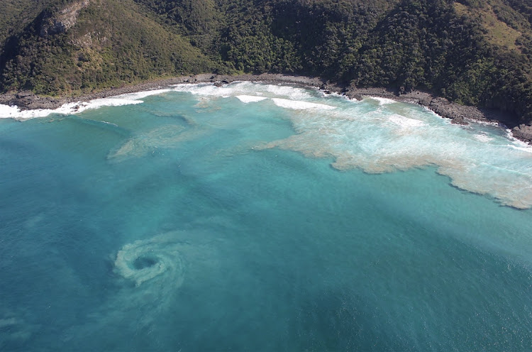 The spinning hole in the ocean, close to the shore at about 245m off Rame Head point, was photographed by Green Scorpion Robert Stegmann during a routine SAPS air patrol on August 17, when the plane was about 350m above the phenomenon.