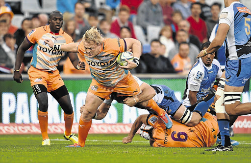 The Cheetahs' Adriaan Strauss is tackled as he tries to break out during yesterday's match against the Force in Bloemfontein