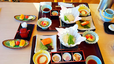 Breakfast at Wakakusa no Yado Maruei. Breakfast came in specific time slots that we could select from. When we arrived, it was a combination of a set meal already ready for us, we could choose whether we wanted white rice, brown rice, or porridge, and there was also a small buffet of side dishes to choose from.