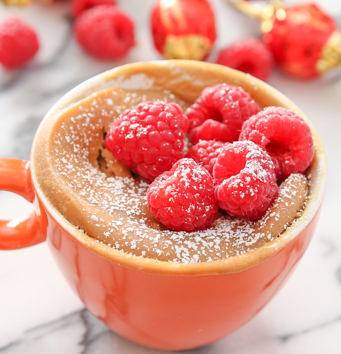 photo of Cookie Butter Chocolate Lava Mug Cake with fresh raspberries