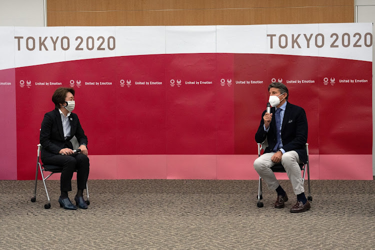 Seiko Hashimoto, president of the Tokyo 2020 Organising Committee (L), listens during a meeting with Sebastian Coe, president of World Athletics, on May 7, 2021 in Tokyo, Japan. Carl Court/Pool via REUTERS