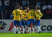 Mamelodi Sundowns players celebrate a goal against Orlando Pirates at Orlando Stadium.