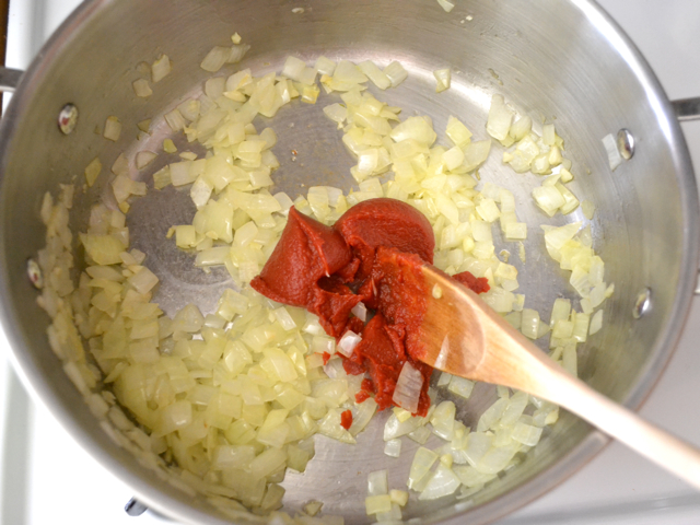 tomato paste added to garlic and onion 