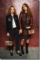 NEW YORK, NY - SEPTEMBER 12:  Petra Collins (L) and Anna Collins pose for a portrait during Coach Spring 2018 Fashion Show during New York Fashion Week at Basketball City - Pier 36 - South Street on September 12, 2017 in New York City.  (Photo by Dave Kotinsky/Getty Images for Coach)