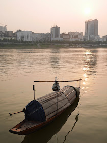 small boat in the Xiang River near sunset in Hengyang, China