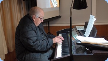 Merv Adair arrived early and snook-in a 10 minute play on the Clavinova before the evening's proceedings commenced. Photo courtesy of Dennis Lyons.