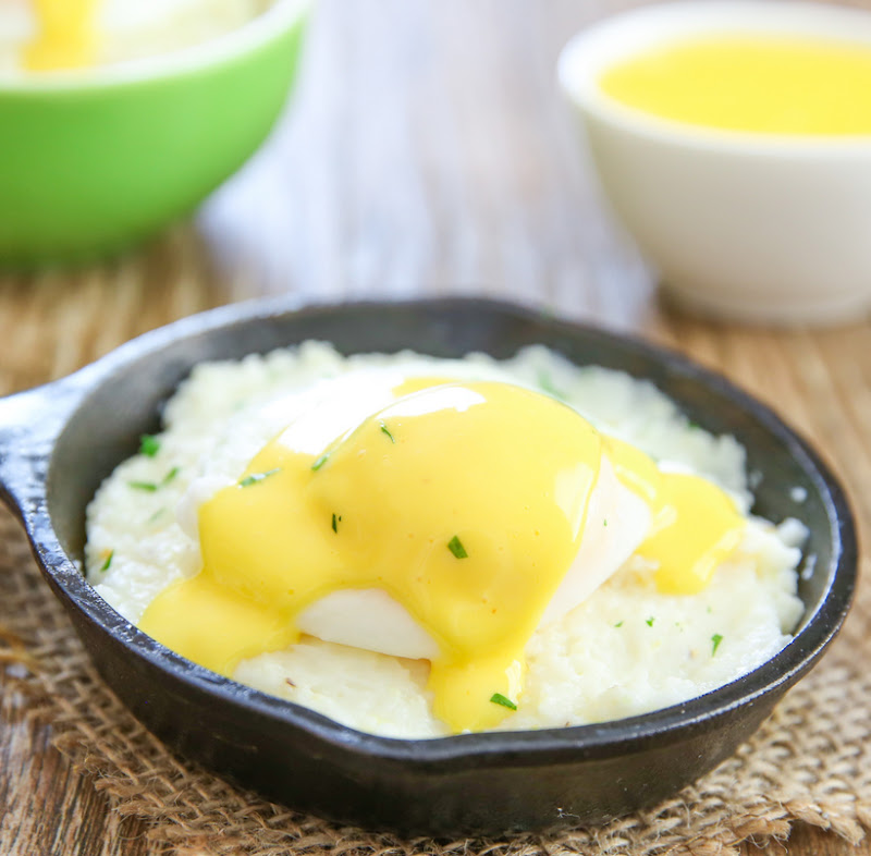 photo of grits topped with a poached egg and hollandaise sauce