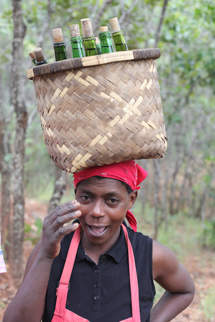 Grace worked in the camp kitchen and, every day, carried drinking water from the spring. We asked her to smile for the camera, but she struggled - the stress on her neck muscles made it almost impossible!
