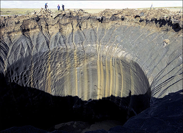 A funnel in the Siberian permafrost on the Yamal peninsula, caused by the explosion of methane from thawing permafrost. In one recent explosion, permafrost soil was thrown around 1 kilometre from the epicentre of the blast, highlighting the huge force, scientists discovered. Flames shot into the sky, and a 50 metre-deep crater was formed from the eruption. Photo: Vasily Bogoyavlensky / The Siberian Times