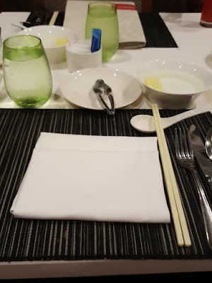 Media tasting place settings. Note the crab cracker and the finger bowl. You have to use your fingers when eating crabs -  there's no way around that.