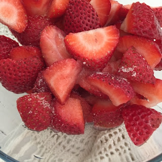 Cut strawberries with sugar. 