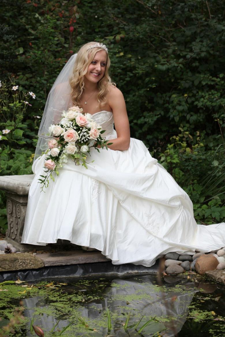 showing her bridal bouquet